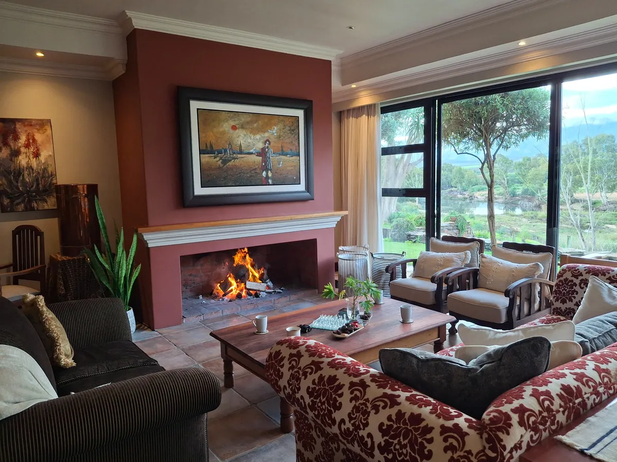 Riverhide living room fireplace with river views